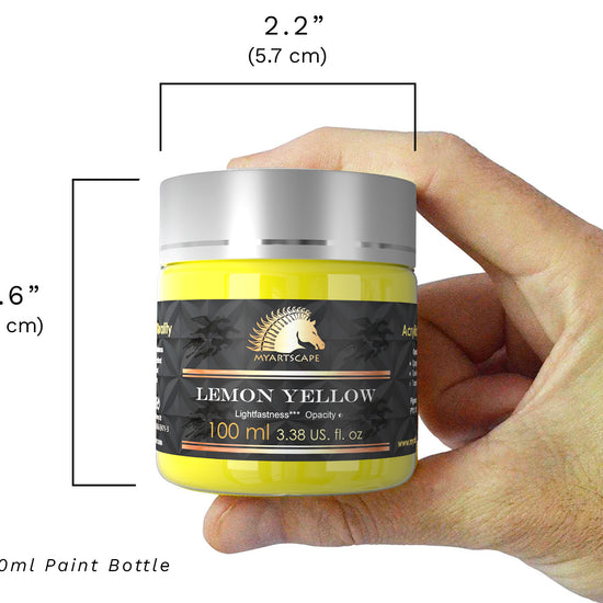 a person holding a jar of lemon yellow paint